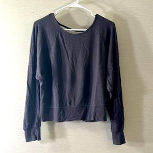 Dark grey long-sleeve sweater top with open back